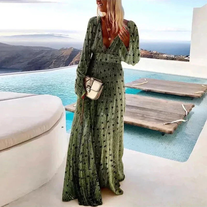 Green pleated maxi dress with textured details, a versatile option in a flowy fabric perfect for gatherings or everyday wear.