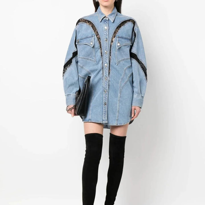 Blue oversized denim dress with zip accents. Casual yet stylish design perfect for a relaxed day out.