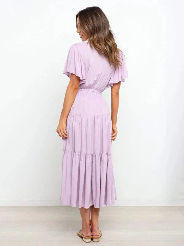 "Valentina tiered midi dress in soft cotton blend with belt, featuring a classic silhouette perfect for versatile styling."