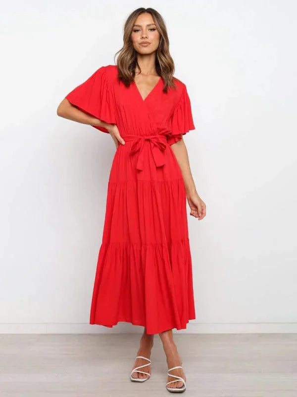 "Red tiered midi dress with belt, ideal for a chic look, featuring a flowy design and crafted with a lightweight,…