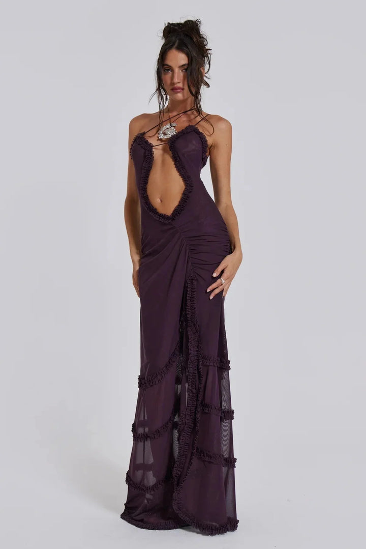 Deep V-neck draped trim maxi dress in soft flowy fabric. Elegant silhouette with intricate detailing.