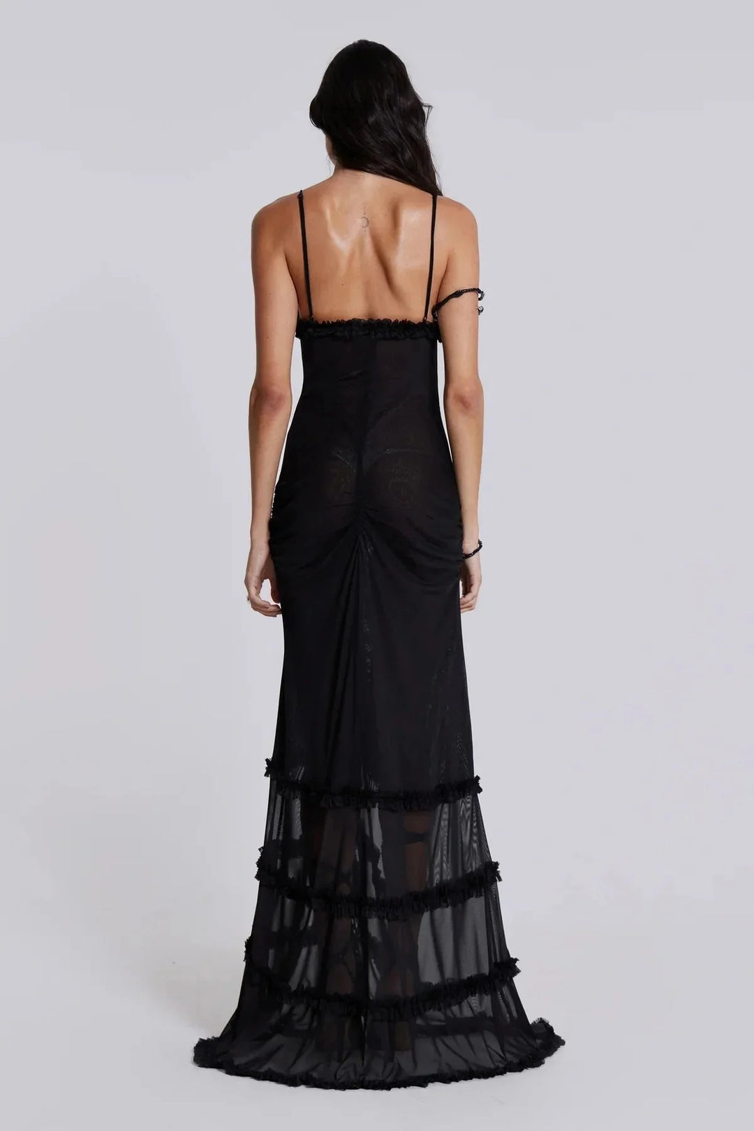 Black maxi dress with a deep V-neck and draped trim, made of soft and flowy fabric. Ideal for special occasions or evening…