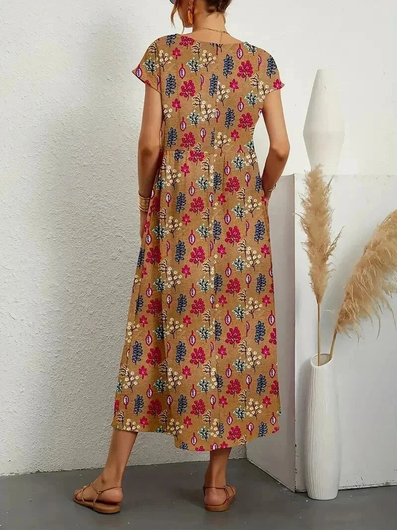 "Cotton midi dress in floral print, perfect for everyday wear or casual occasions."