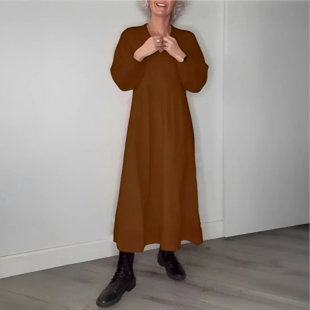 Brown maxi dress with long sleeves, perfect for cooler days. Made from soft and cozy material, versatile for various…