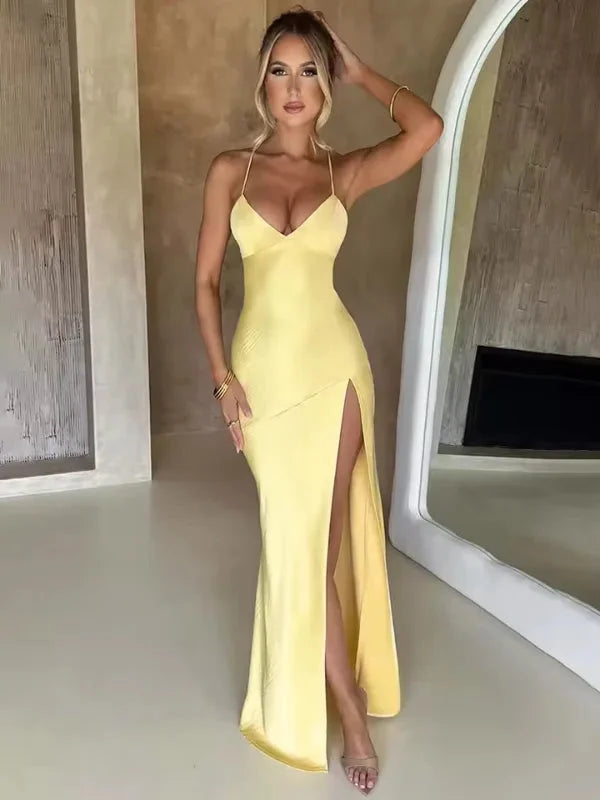 Yellow halter neck evening dress with high slit, made of soft satin fabric. Elegant design suitable for formal occasions and…