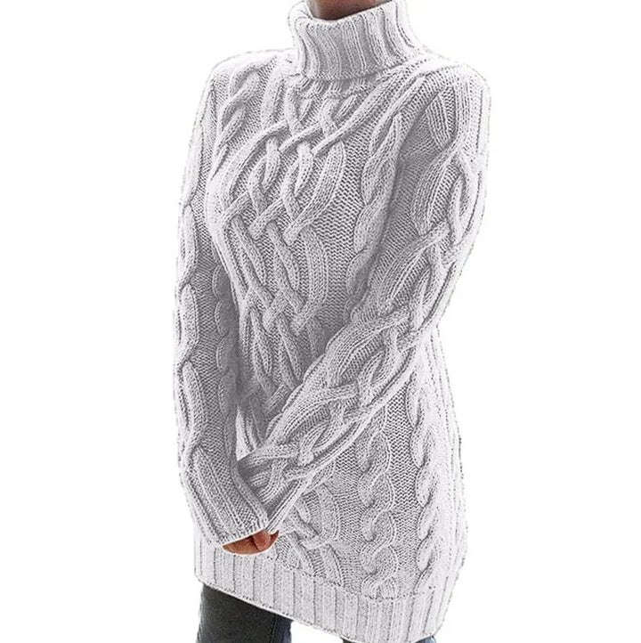 White cable knit turtleneck dress in soft wool blend, perfect for cozy winter days.