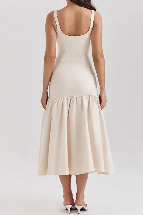 Sleeveless drop-waist dress with flared skirt in soft cotton blend, perfect for casual days or special occasions.