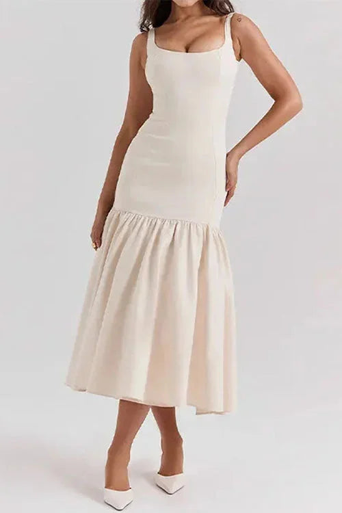 "Sleeveless drop-waist dress with flared skirt in soft cotton fabric, ideal for casual outings and gatherings."