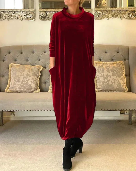 Red velvet midi dress with side pockets, featuring a soft and luxurious texture, perfect for a stylish yet comfortable look.